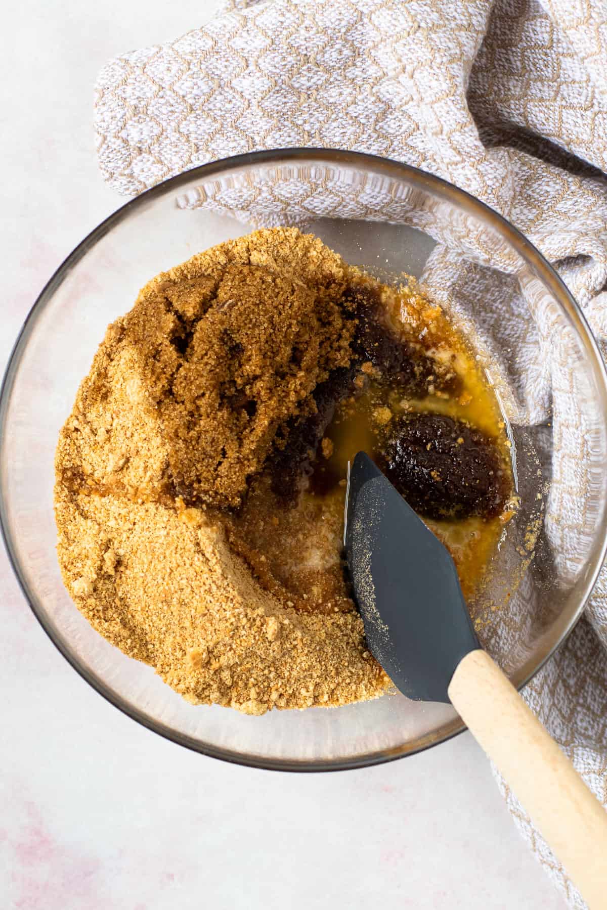 Graham cracker pie ingredients mixed together in a bowl.