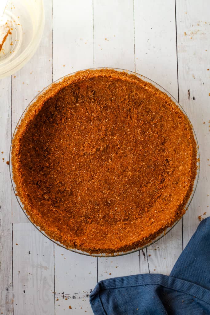 A baked gingersnap pie crust.