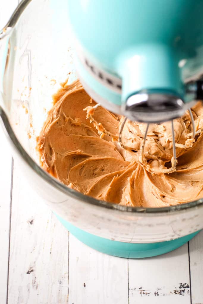 A no bake pumpkin pie filling mixture in a stand mixer.