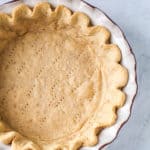 A fully baked pie shell without a filling.