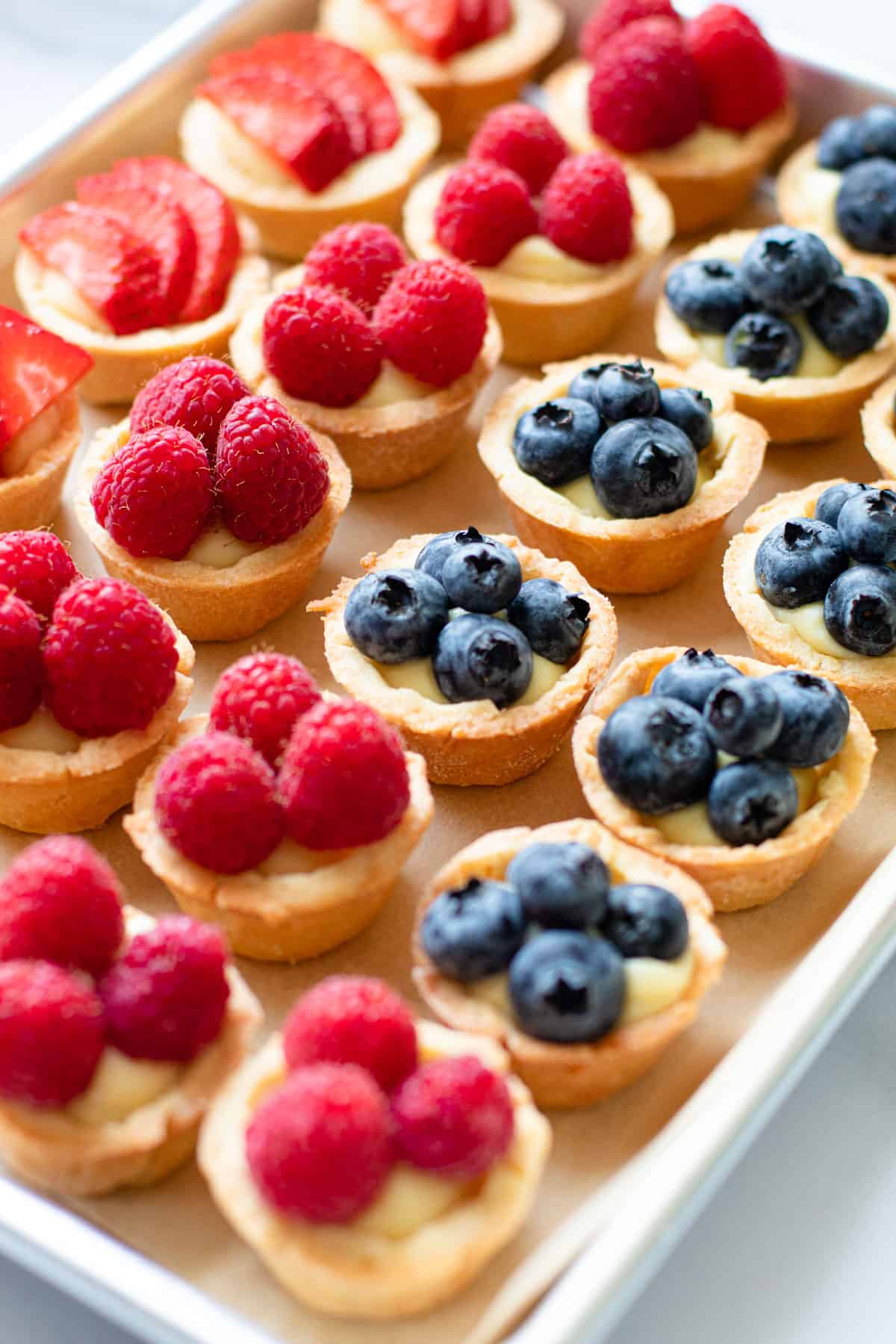 Mini fruit tarts made of pastry cream.