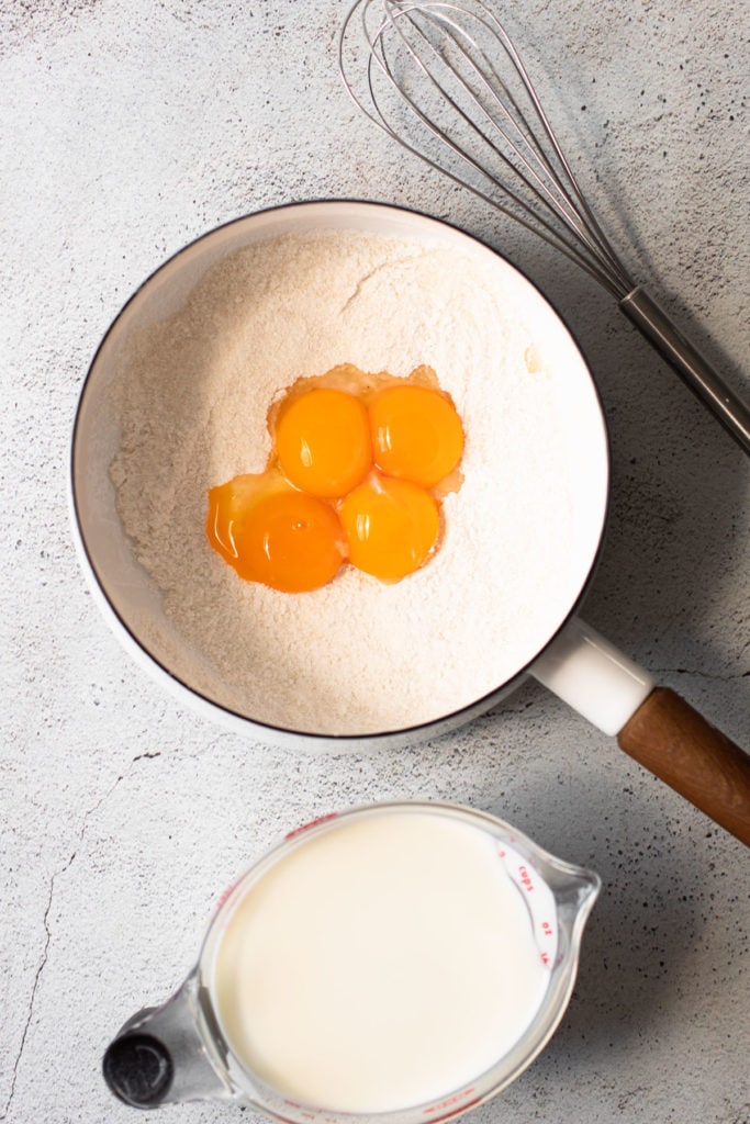 Egg yolks in a pot to make pastry cream.