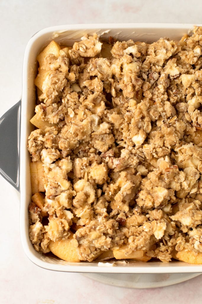 Apple crisp in a pan before baking.