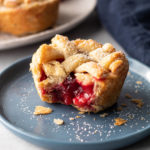 Mini cranberry pear pie on a plate.