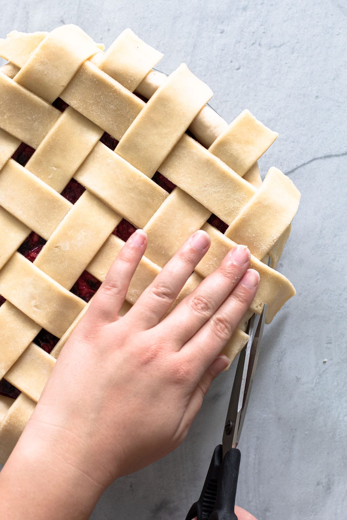 Cutting a lattice pie crust.