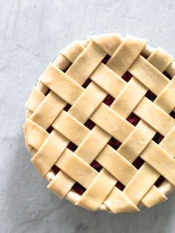 An unbaked lattice pie crust.