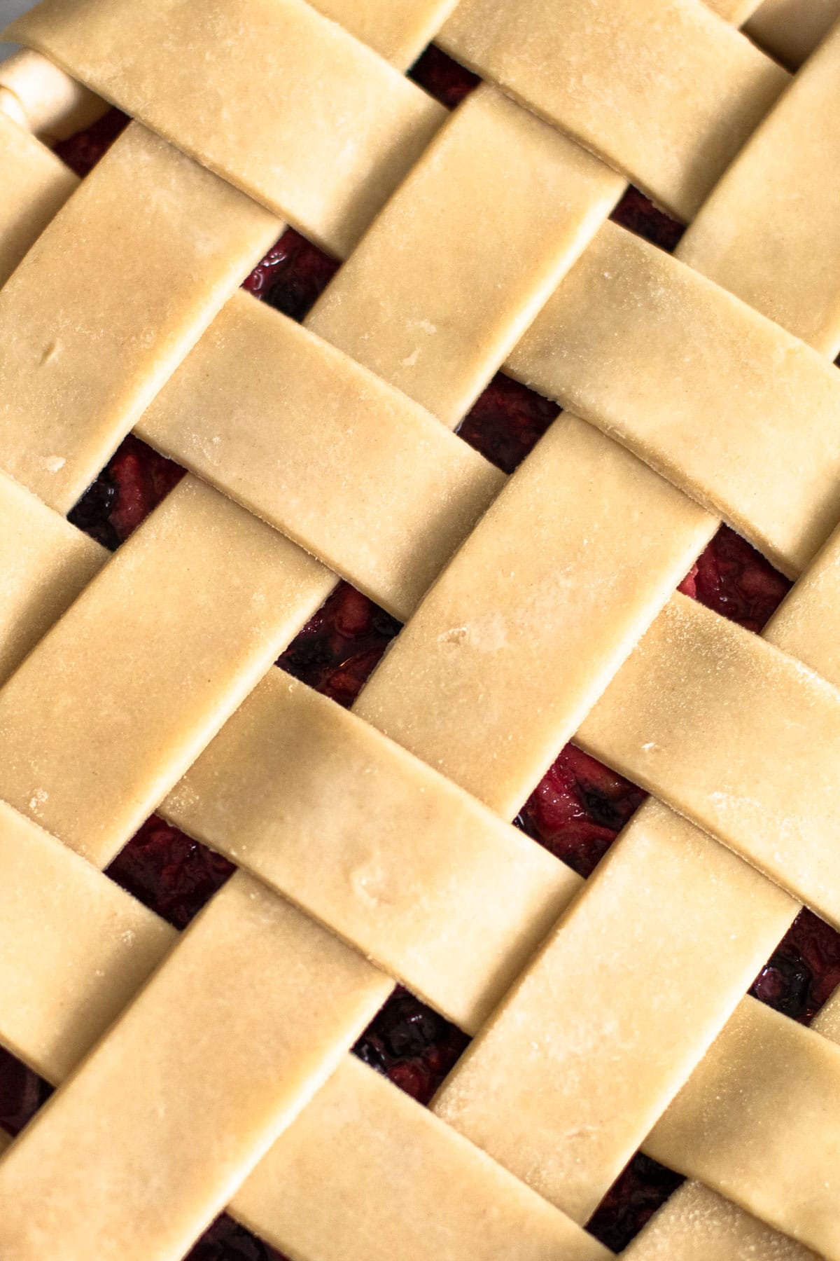 A lattice pie crust close up.
