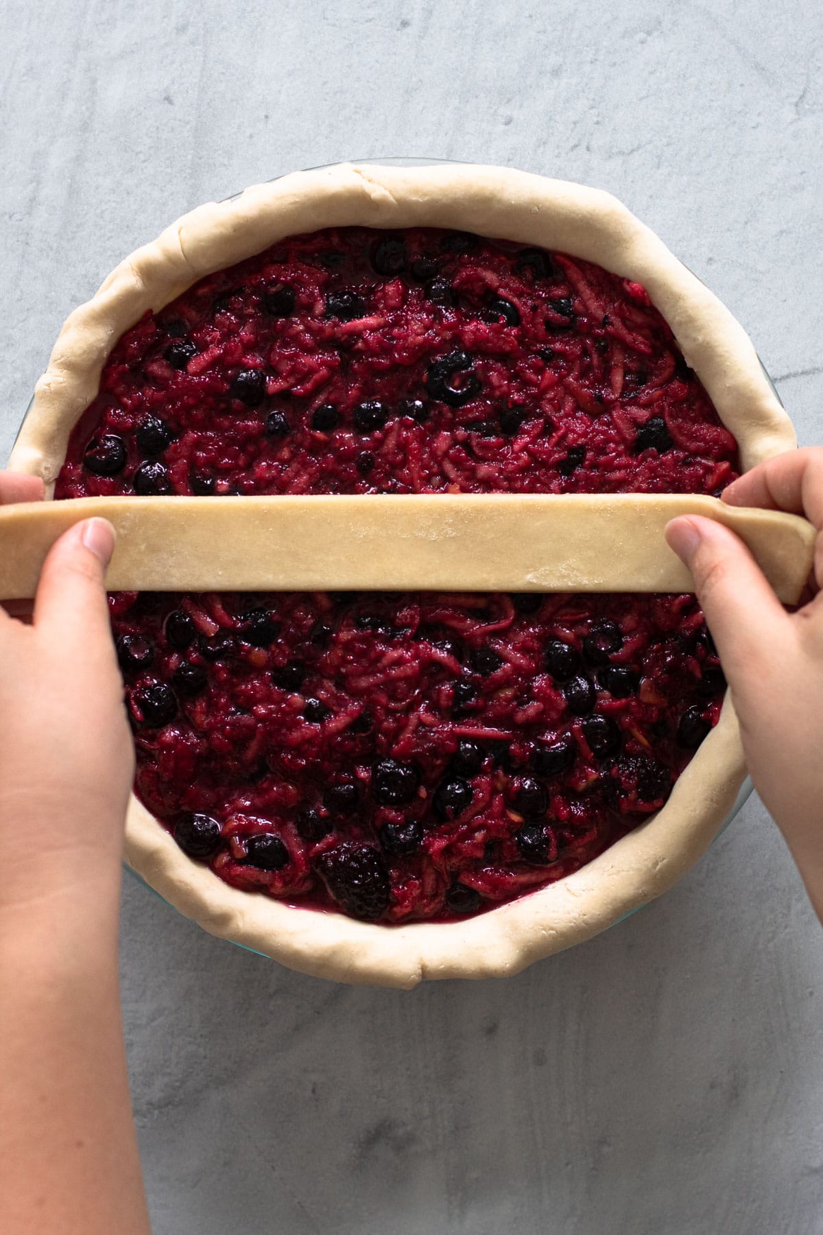 Making a lattice crust for a pie.