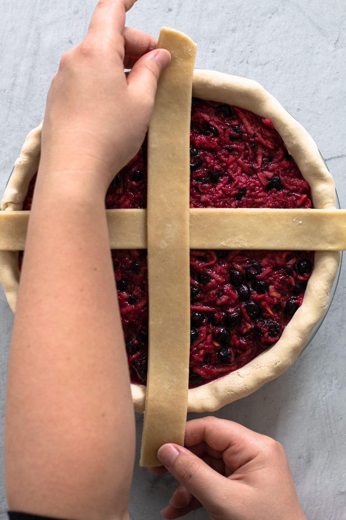 Making a lattice crust for a pie.