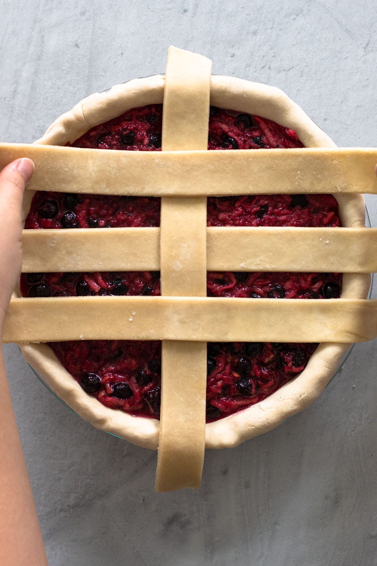 Making a lattice crust for a pie.