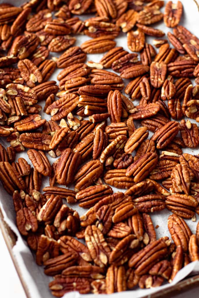 Toasted pecans on a sheet tray.