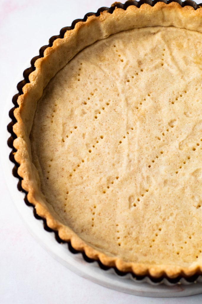 A blind baked toasted coconut pastry shell.