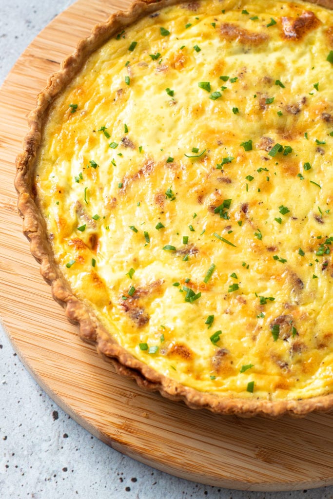 A quiche Lorraine with chives on top.