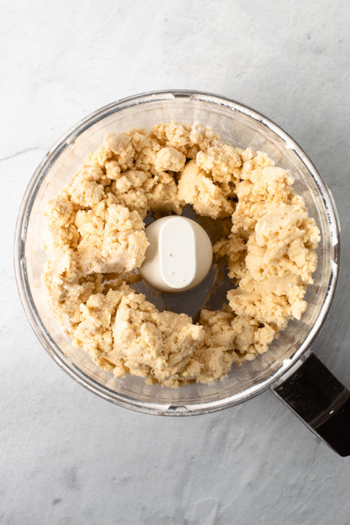 Pate Brisee being made in a food processor.