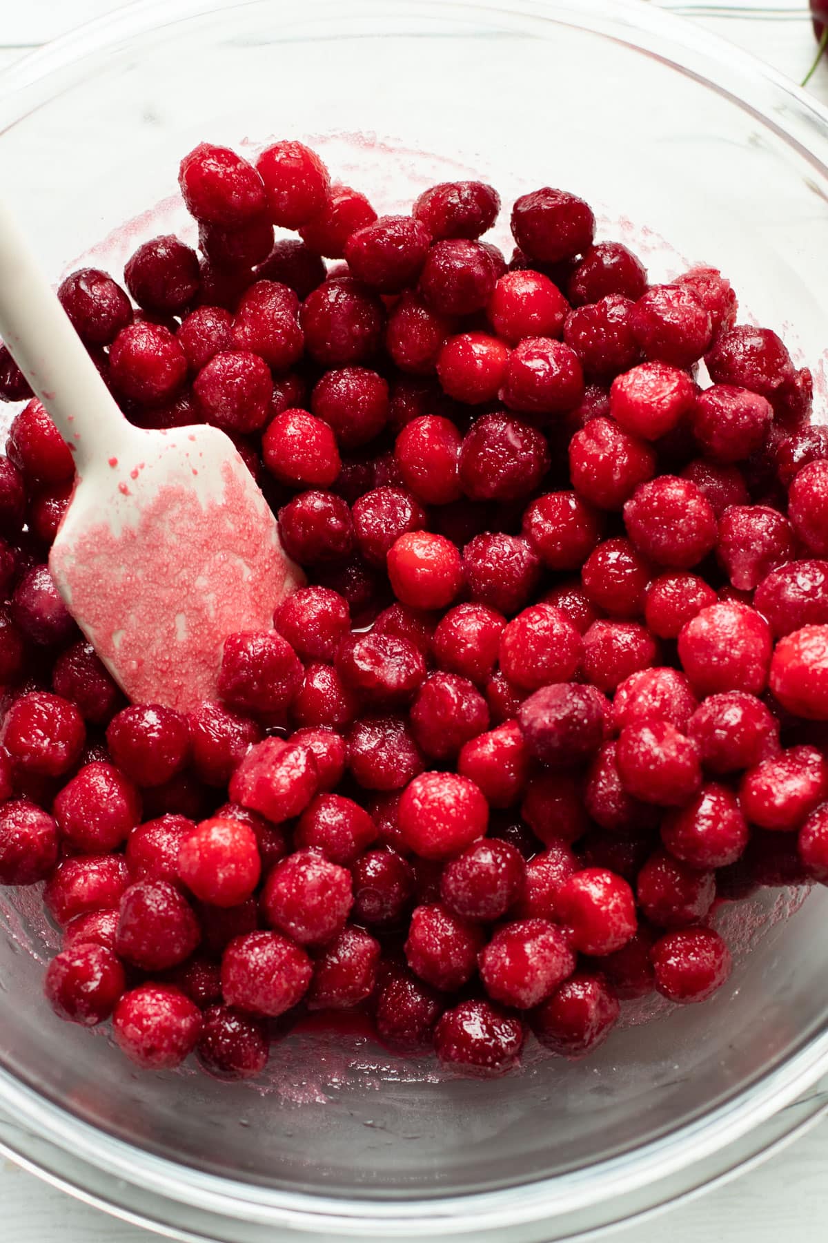 Sour cherries macerating with sugar.