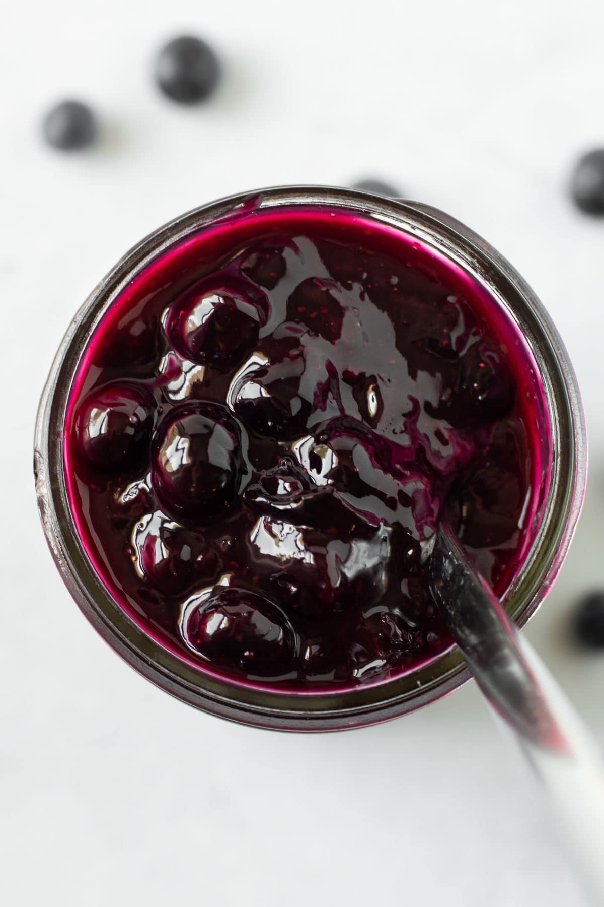 Cooked blueberry pie filling in a jar.