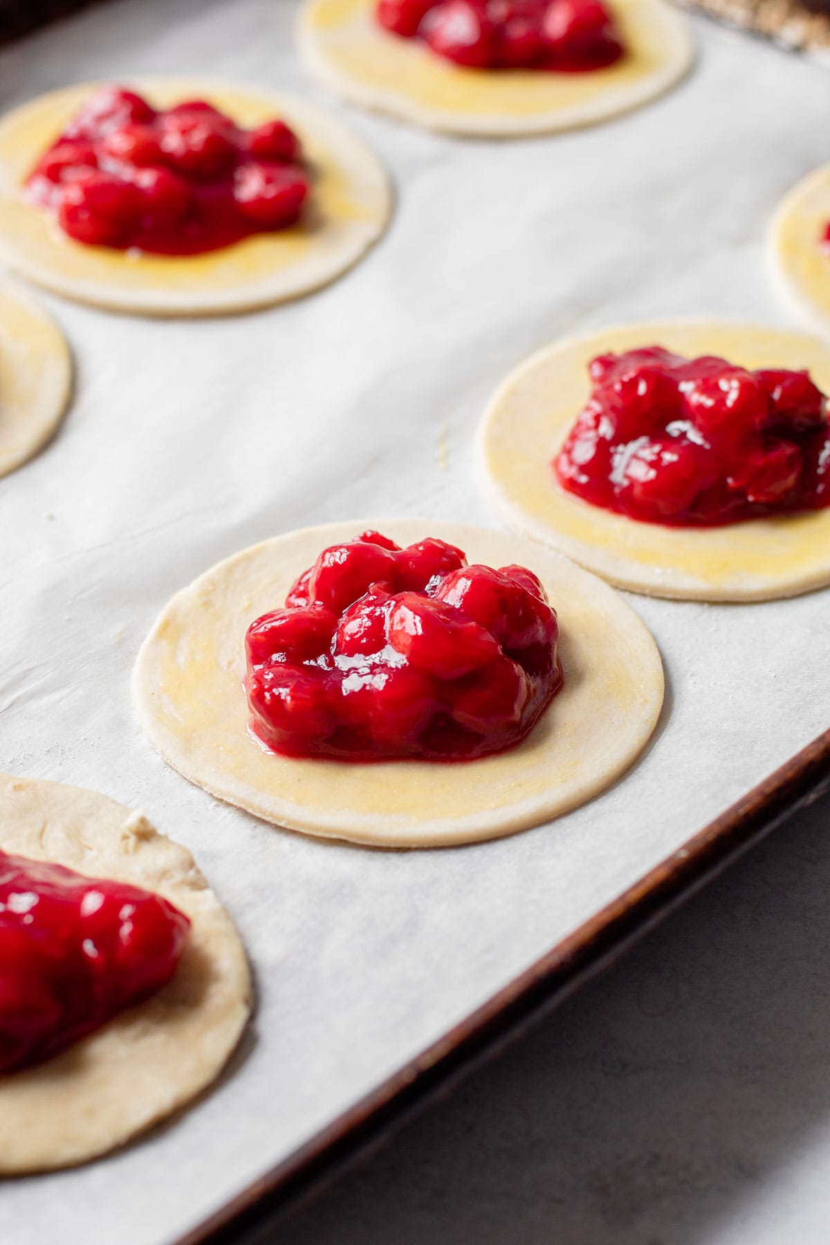 Cherry hand pies with filling inside.