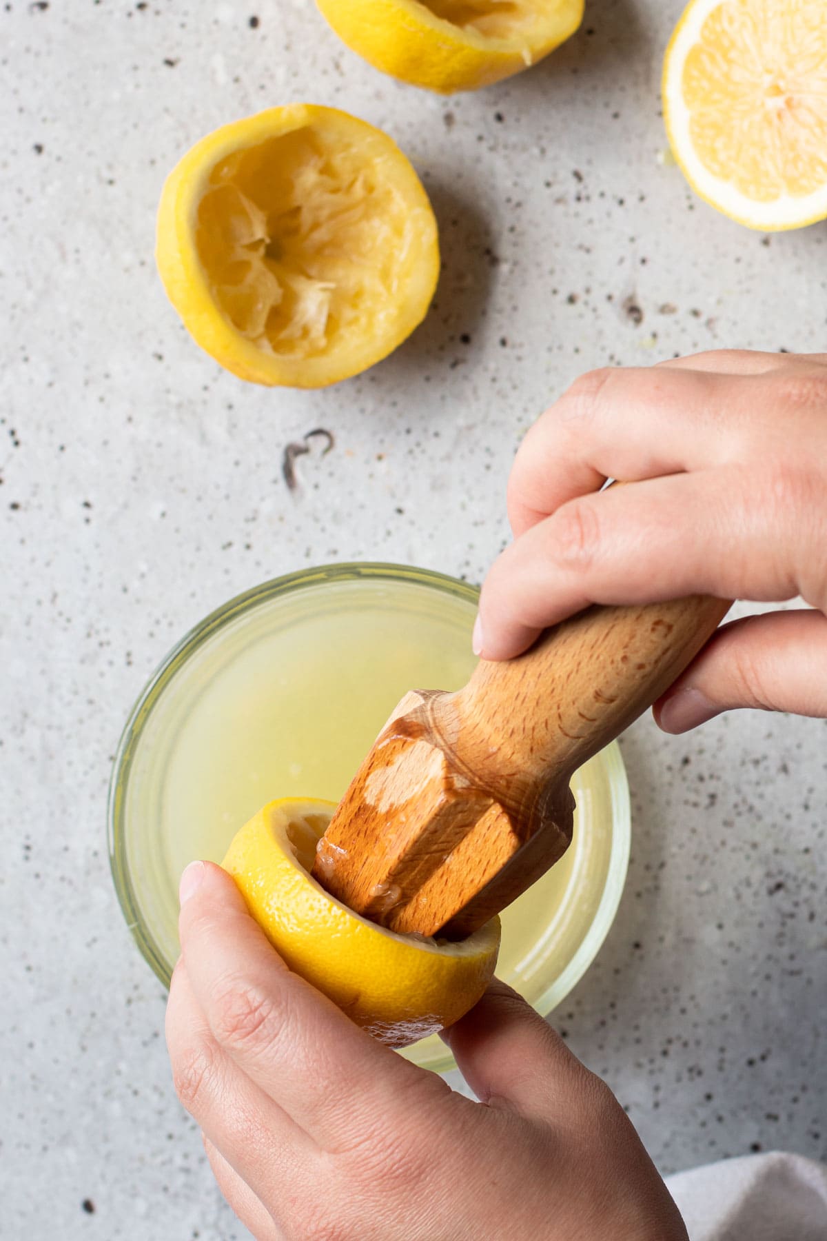 Juicing fresh lemons for a lemon curd recipe.