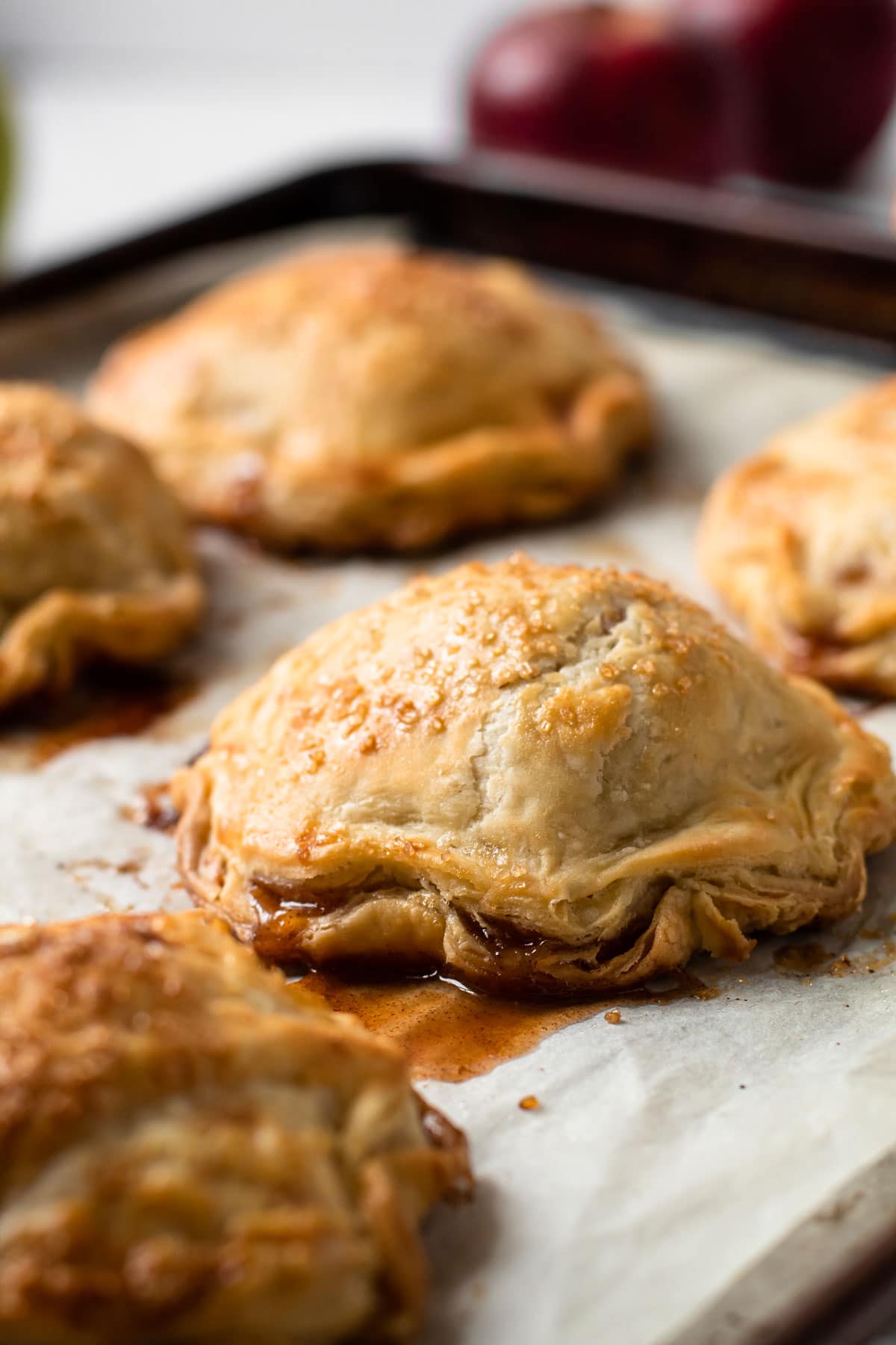 Apple hand pies on a sheet tray.