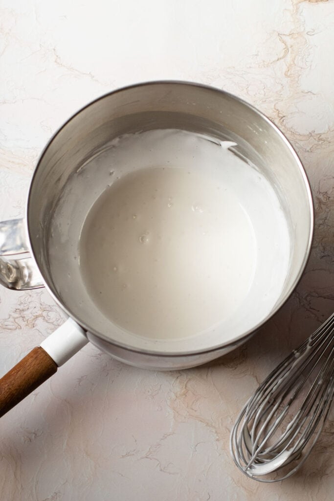 Whipped egg whites over a double boiler.