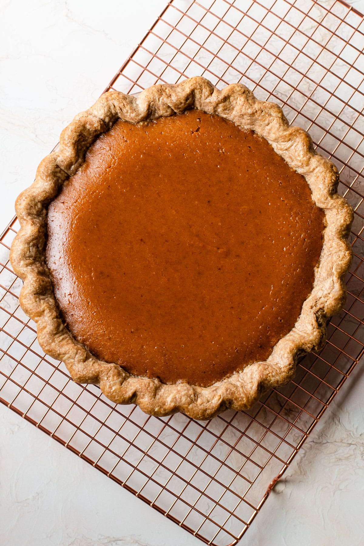 A pumpkin pie fresh from the oven.