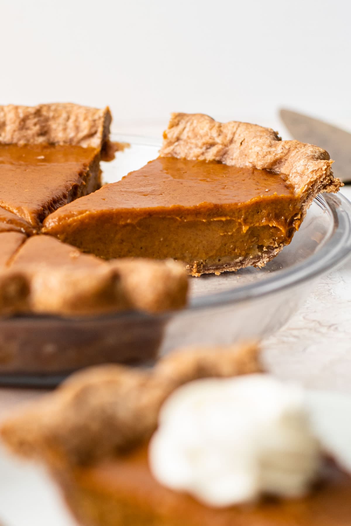 A sliced creamy pumpkin pie.