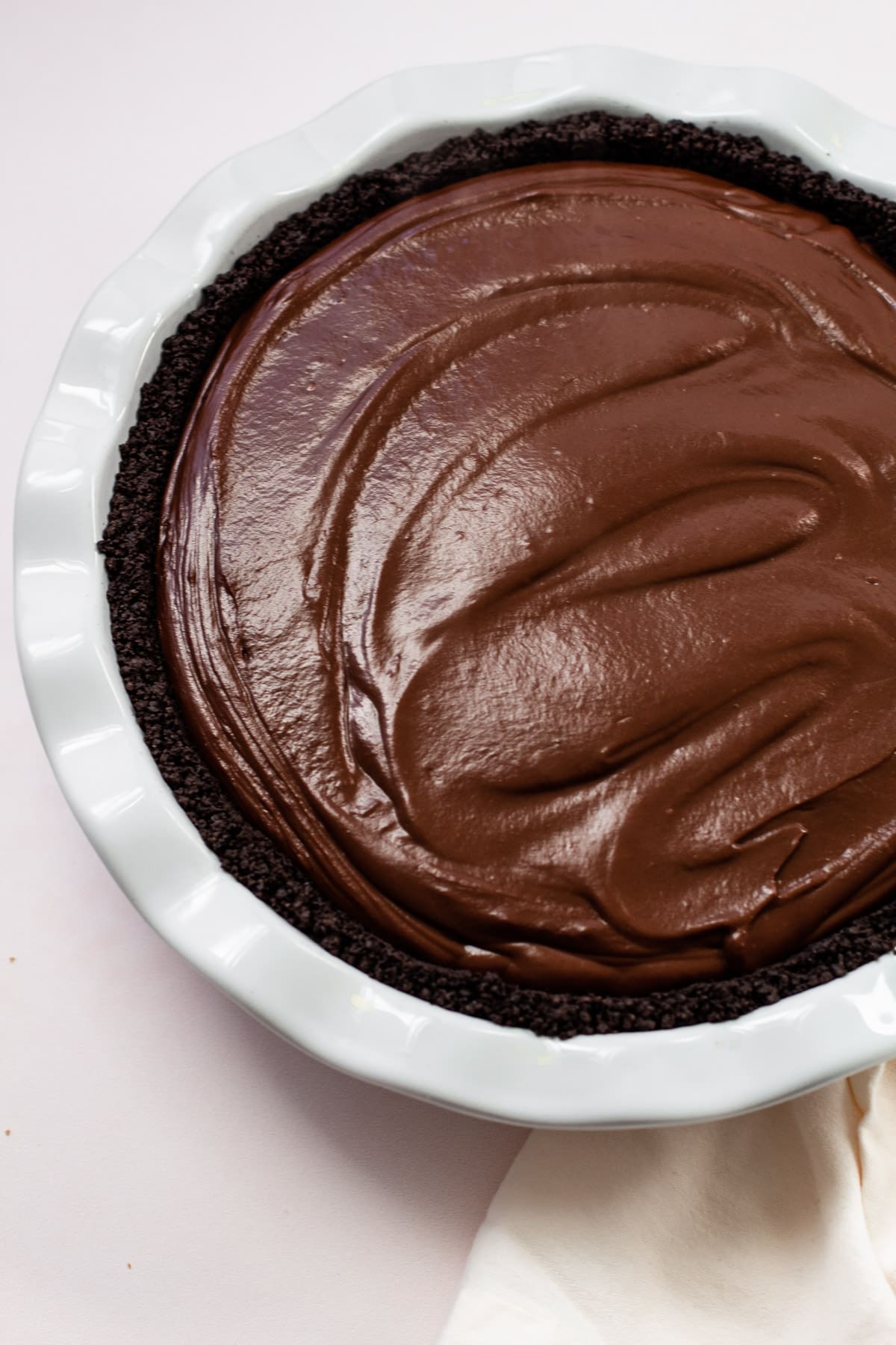 An oreo crumb crust with a chocolate pie.