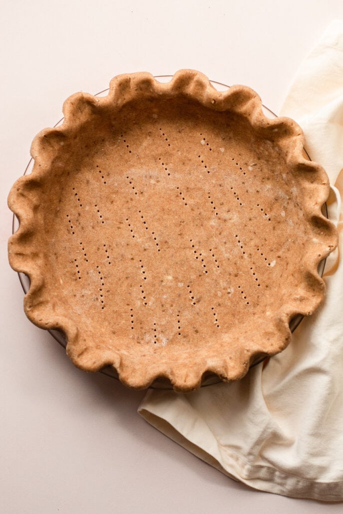 A rolled out spelt flour pie crust raw.