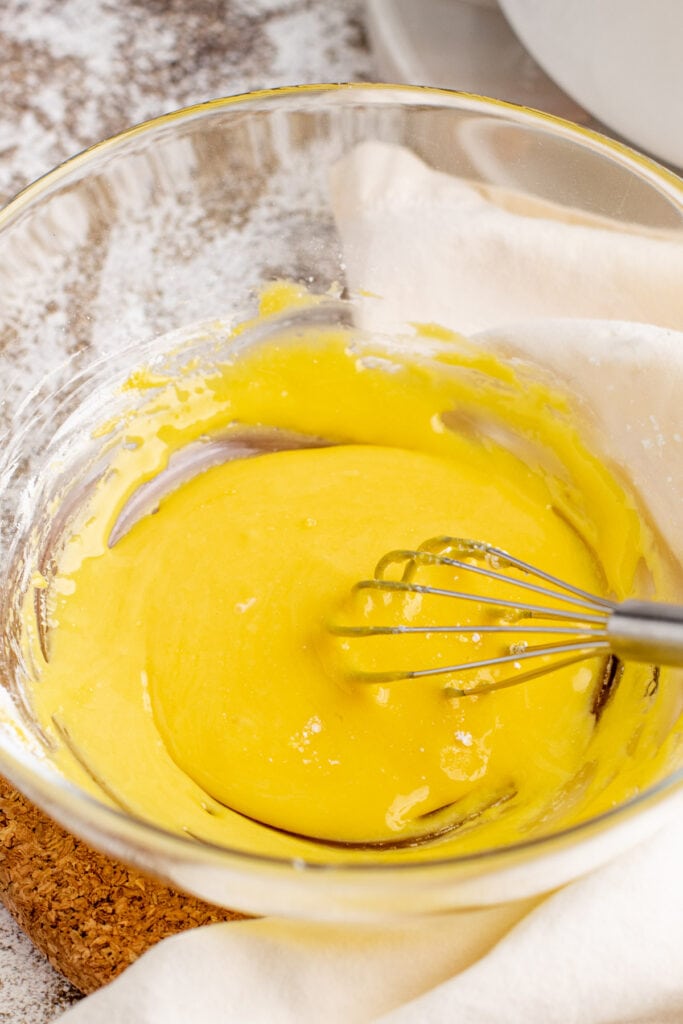 Cornstarch and egg yolks whisked together in a bowl.