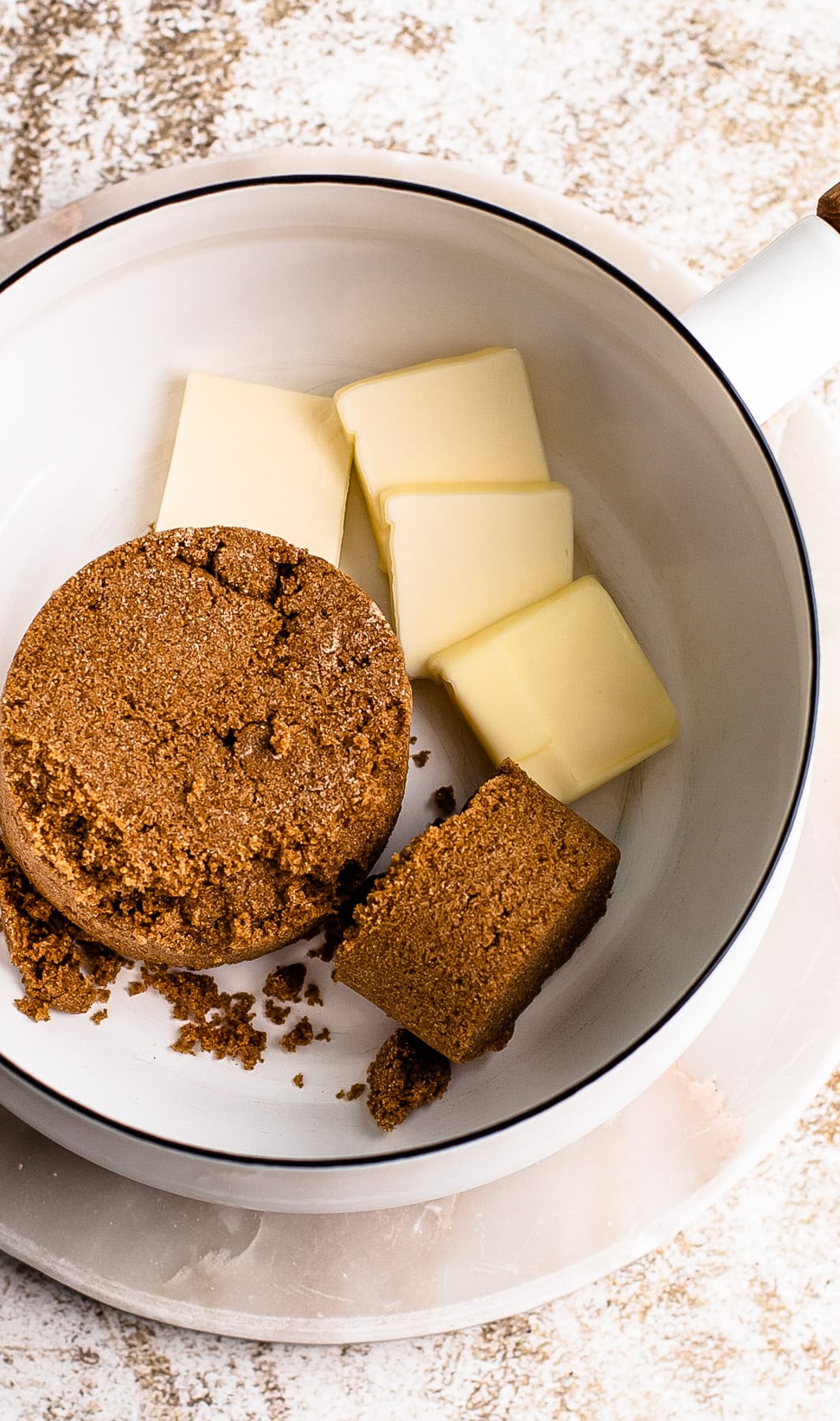 Brown sugar and butter in a pot.