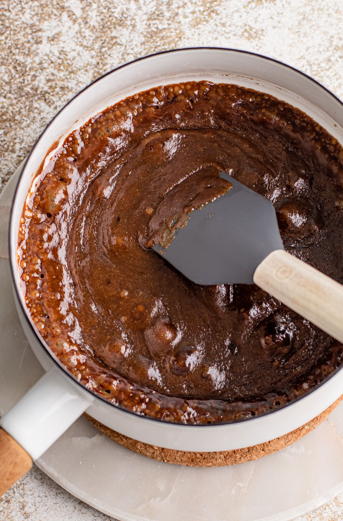 Bubbling brown sugar in a pot.