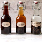 Three jars of homemade vanilla extract.