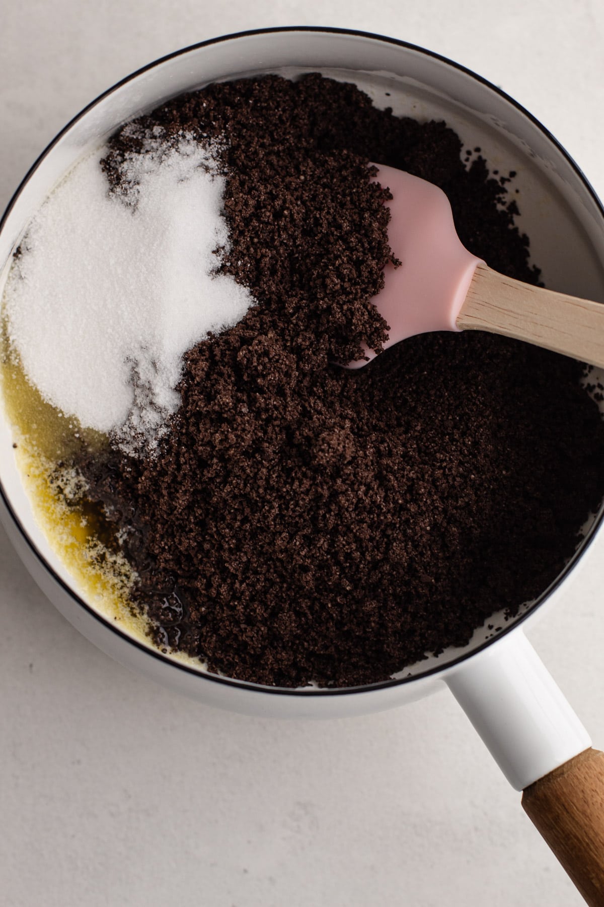 Oreo cookie crust ingredients in a pot.
