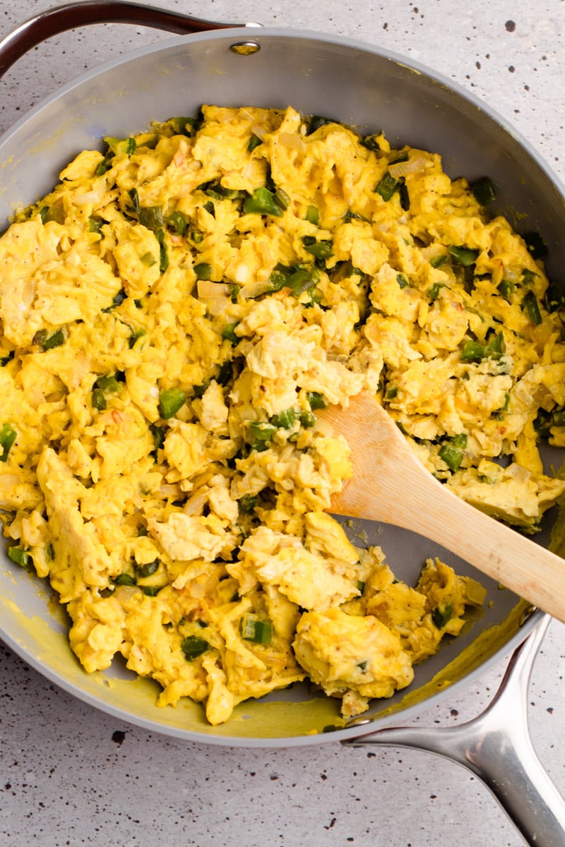 Scrambled eggs and peppers for a breakfast slab pie.