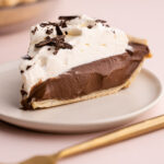 A slice of chocolate cream pie.