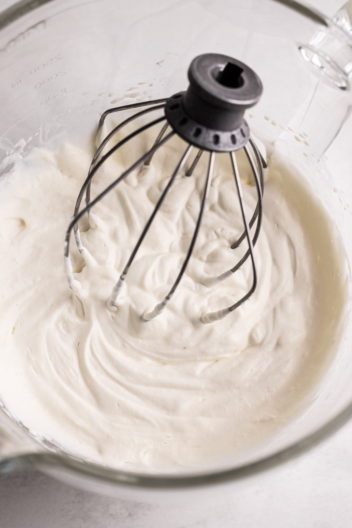 Whipped cream in a mixing bowl.