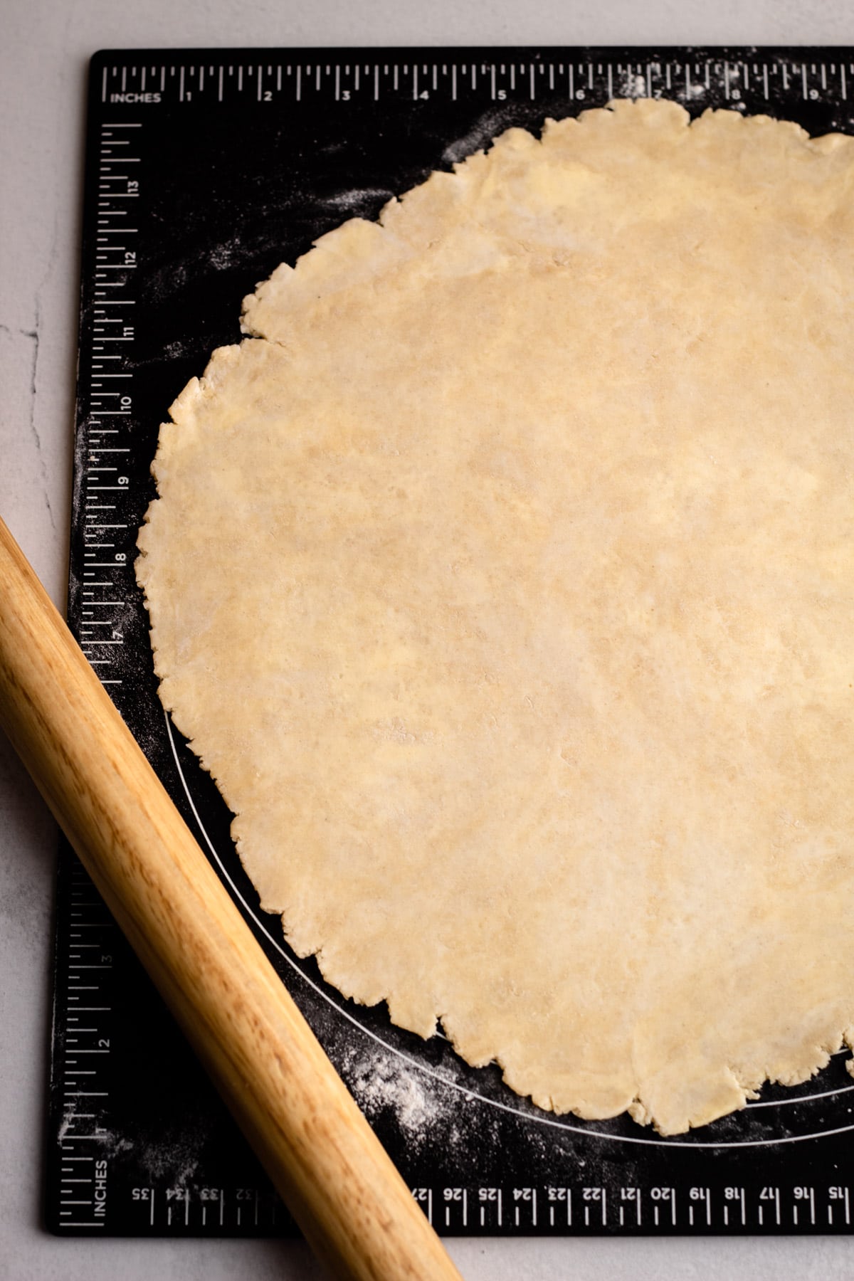 Pie crust on a pastry board.