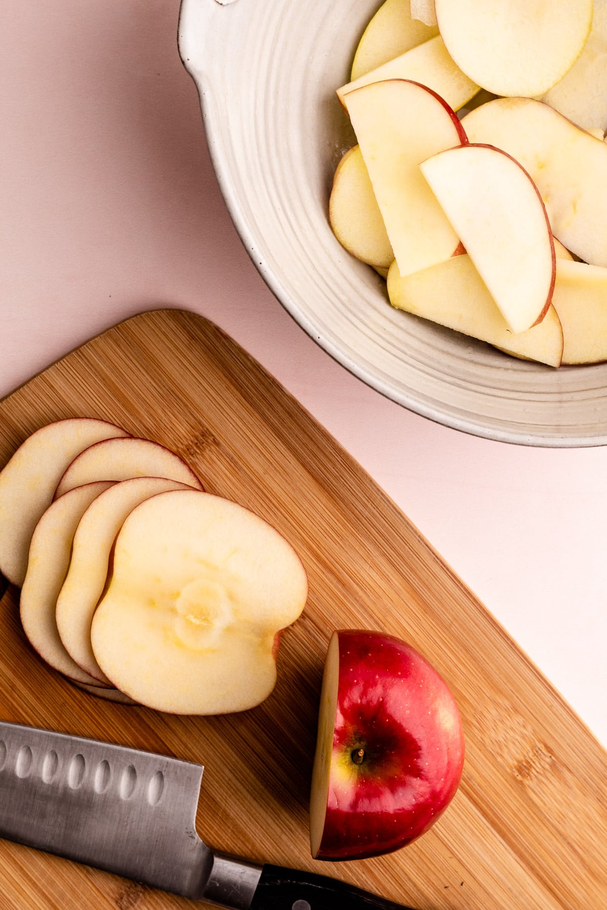 Sliced apples on a cutting board.