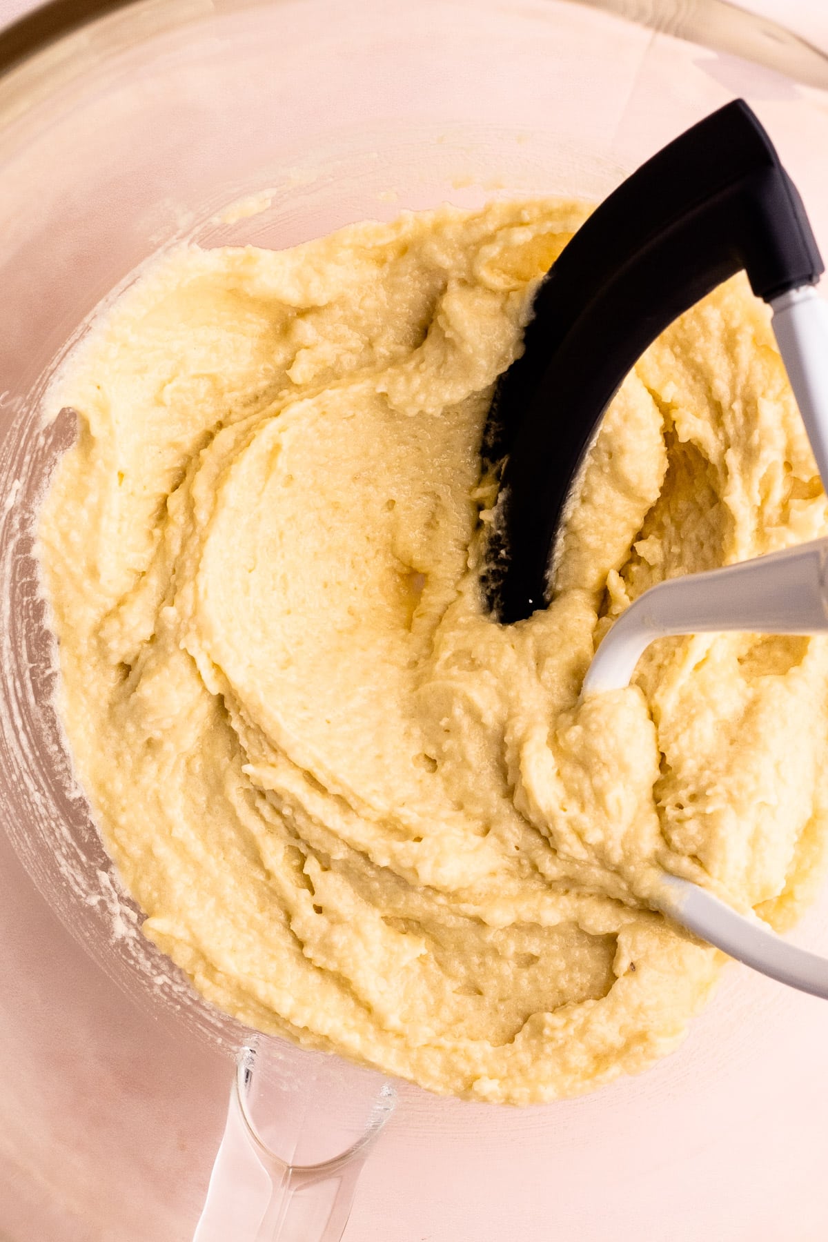 Almond cream in a bowl of an electric mixer.