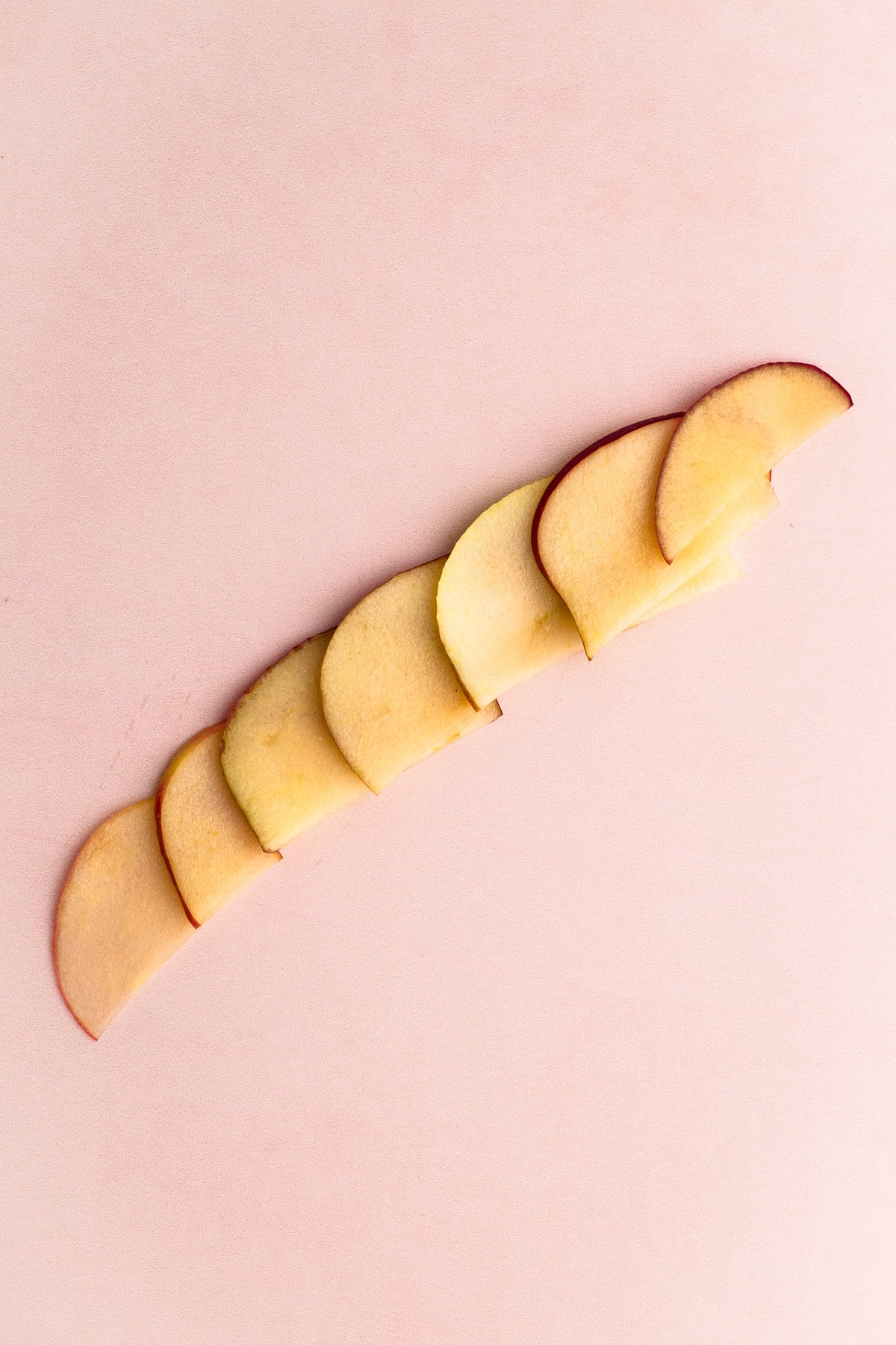 Apple slices on a work surface.