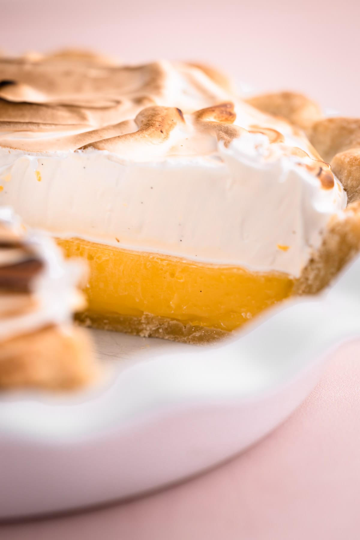 A sliced lemon meringue pie.