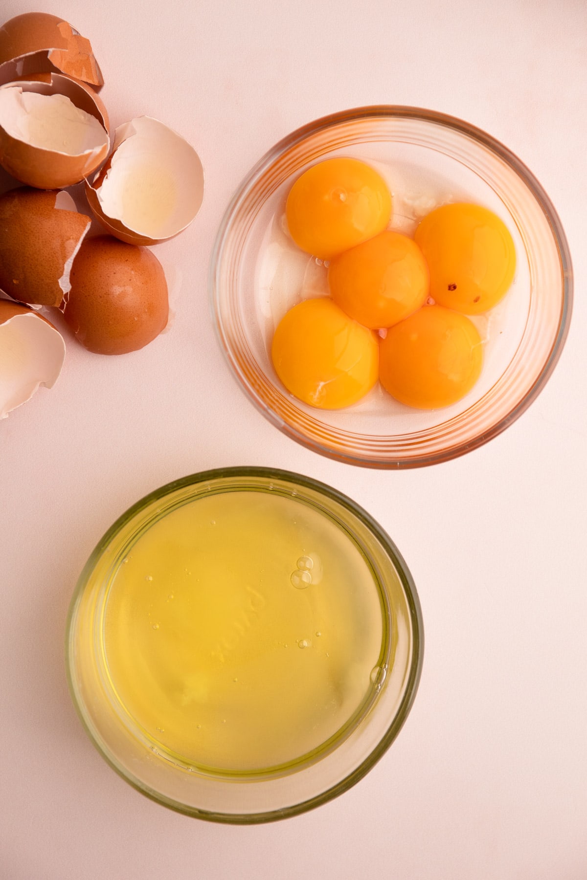 Five eggs seperated between whites and yolks.