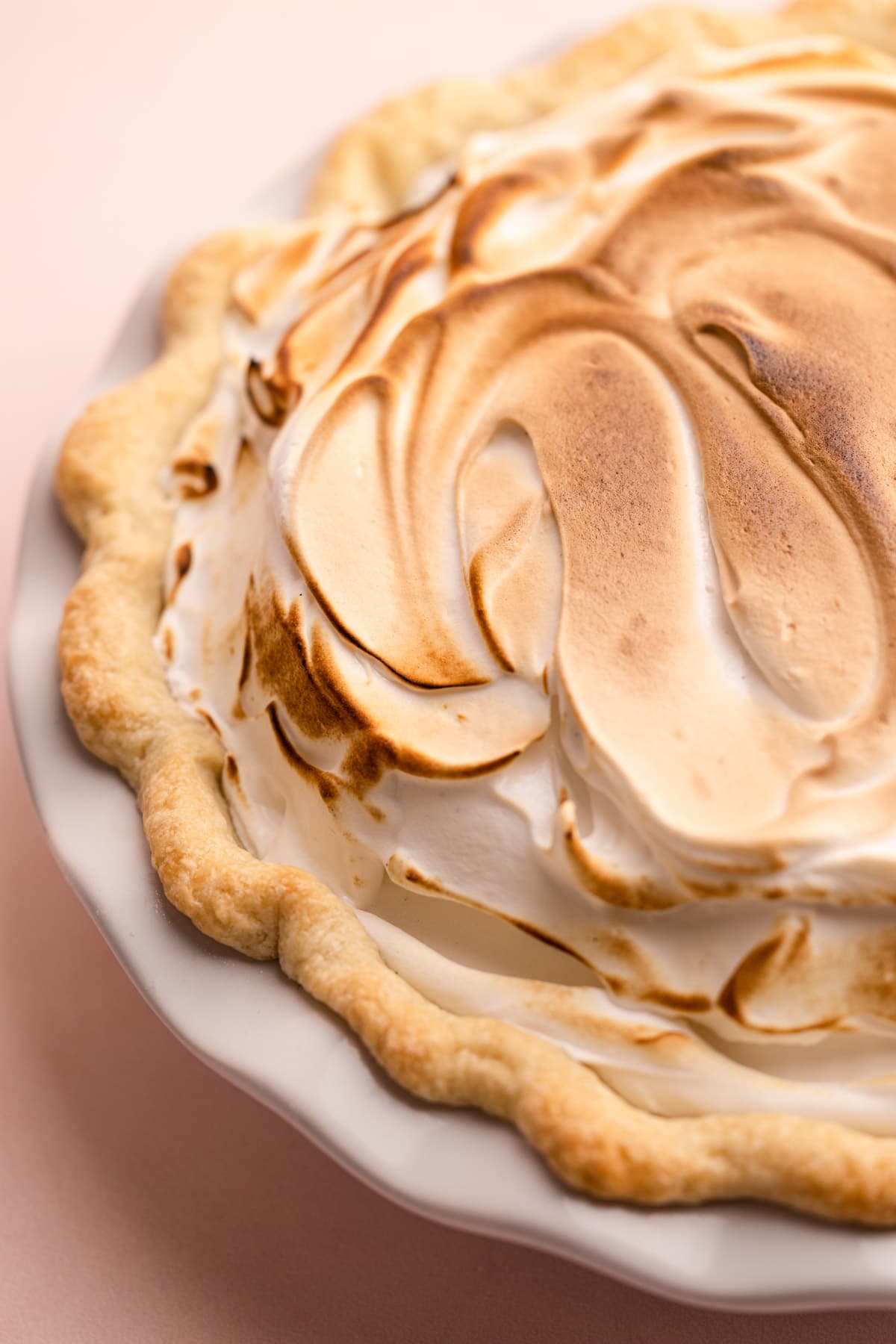 A lemon meringue pie will a fluffy torched meringue top.