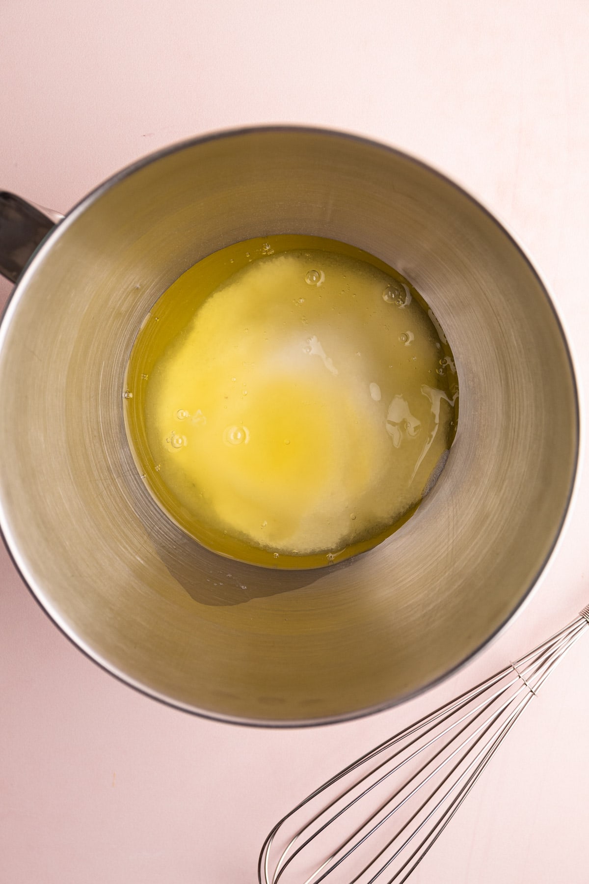 Egg whites and sugar in a bowl.