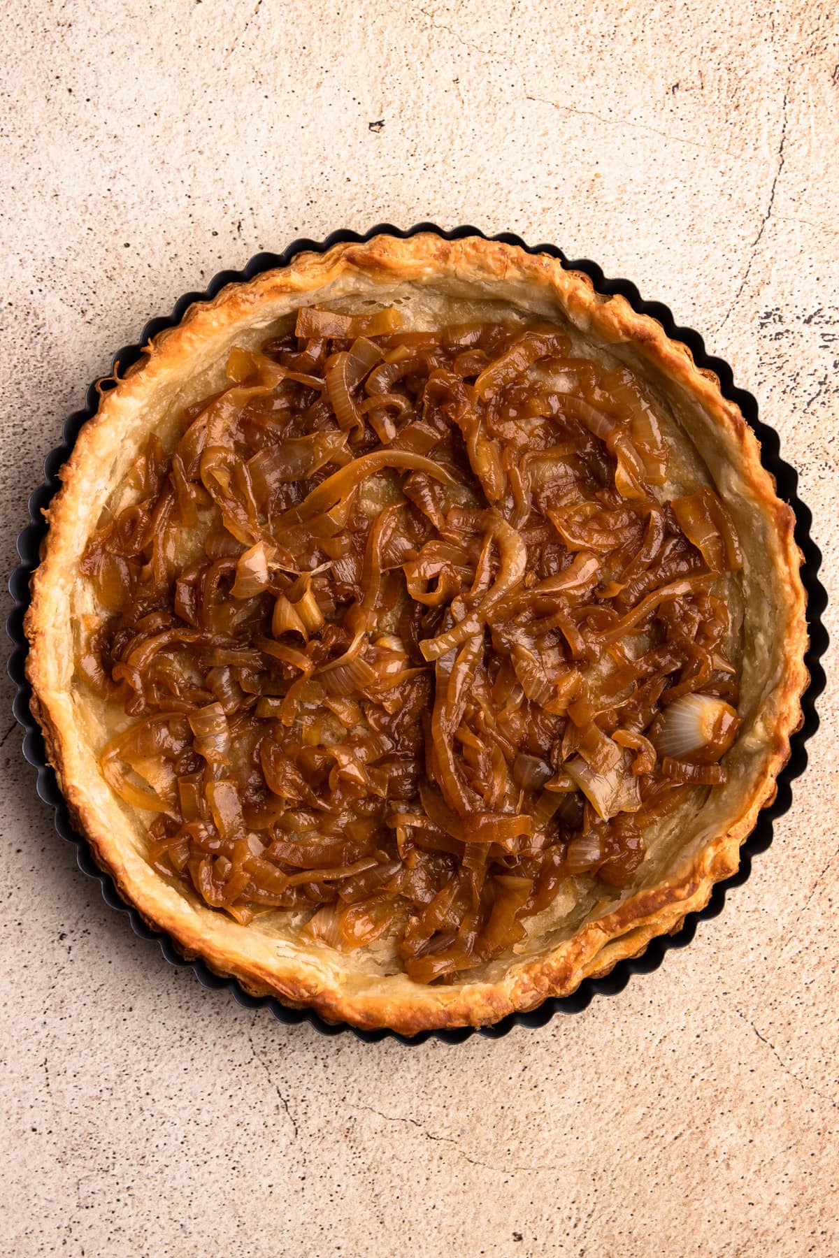 Caramelized onions in a baked pie shell.