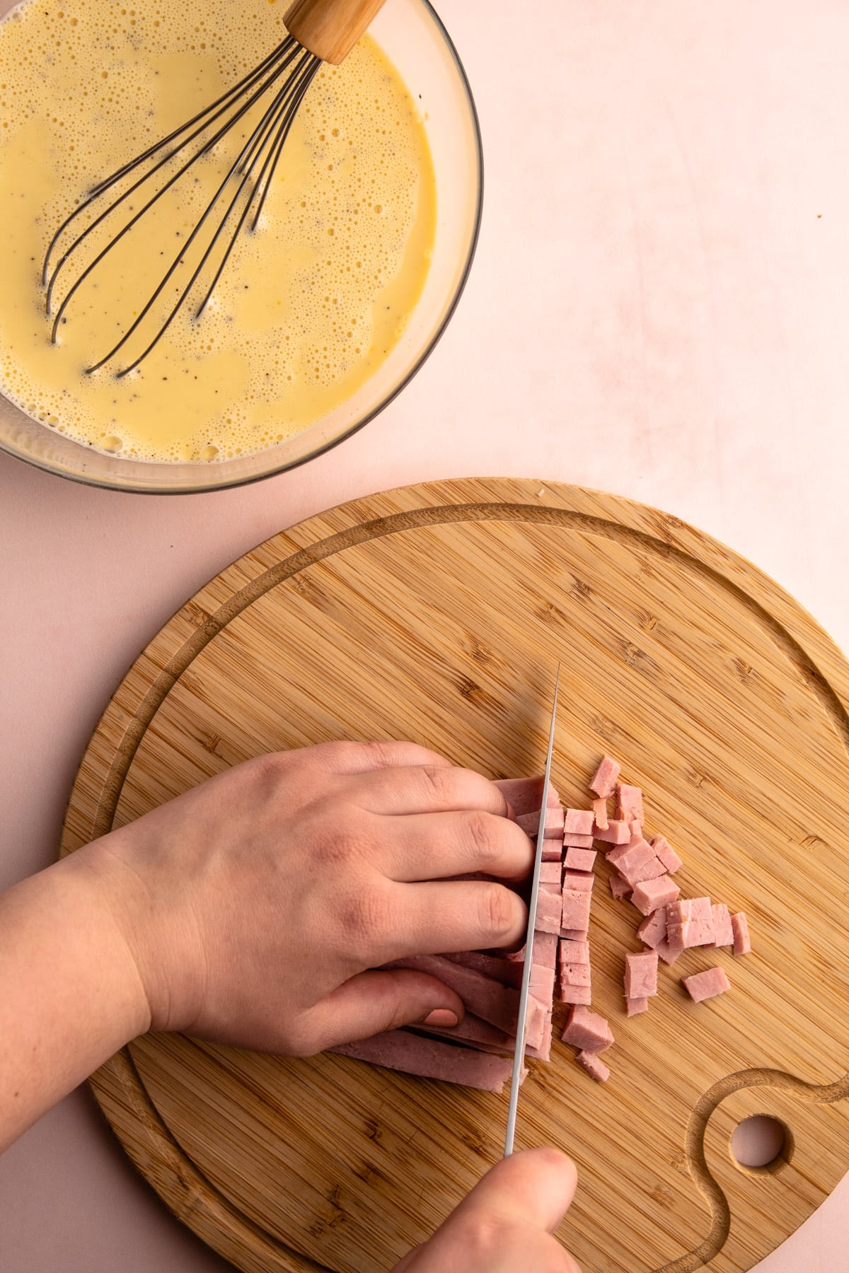 Cutting ham for ham and cheese quiche.