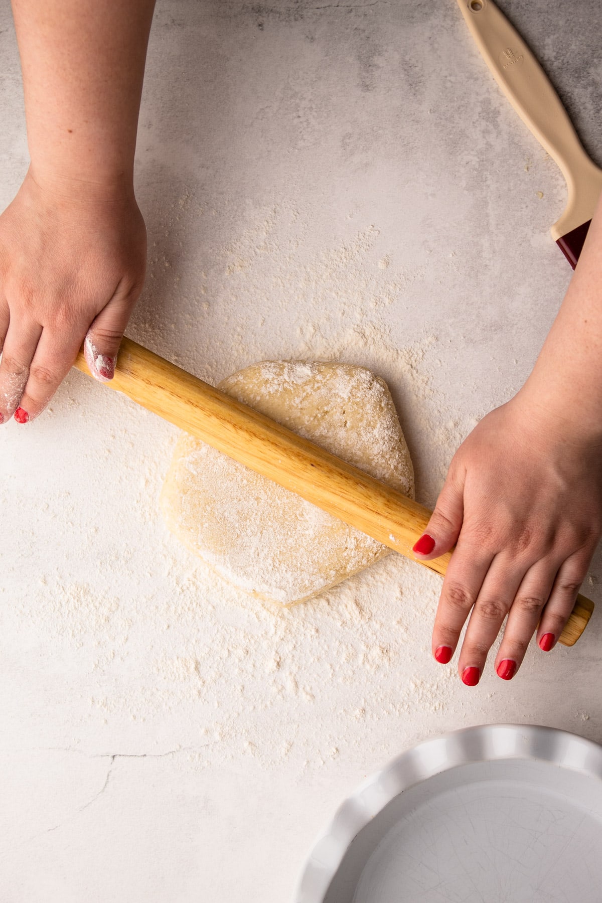 Rolling out pie crust.