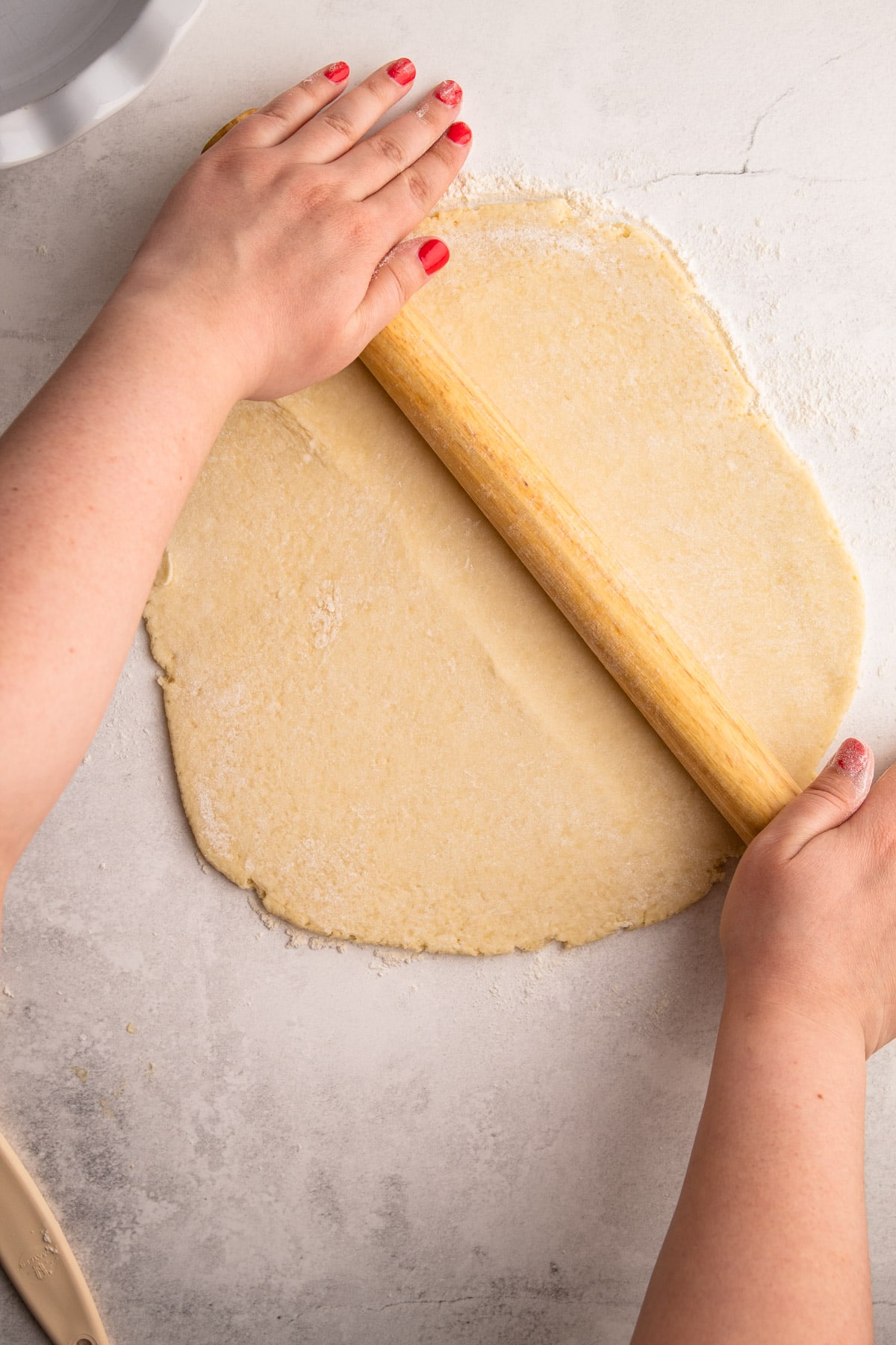 Rolling out pie crust.