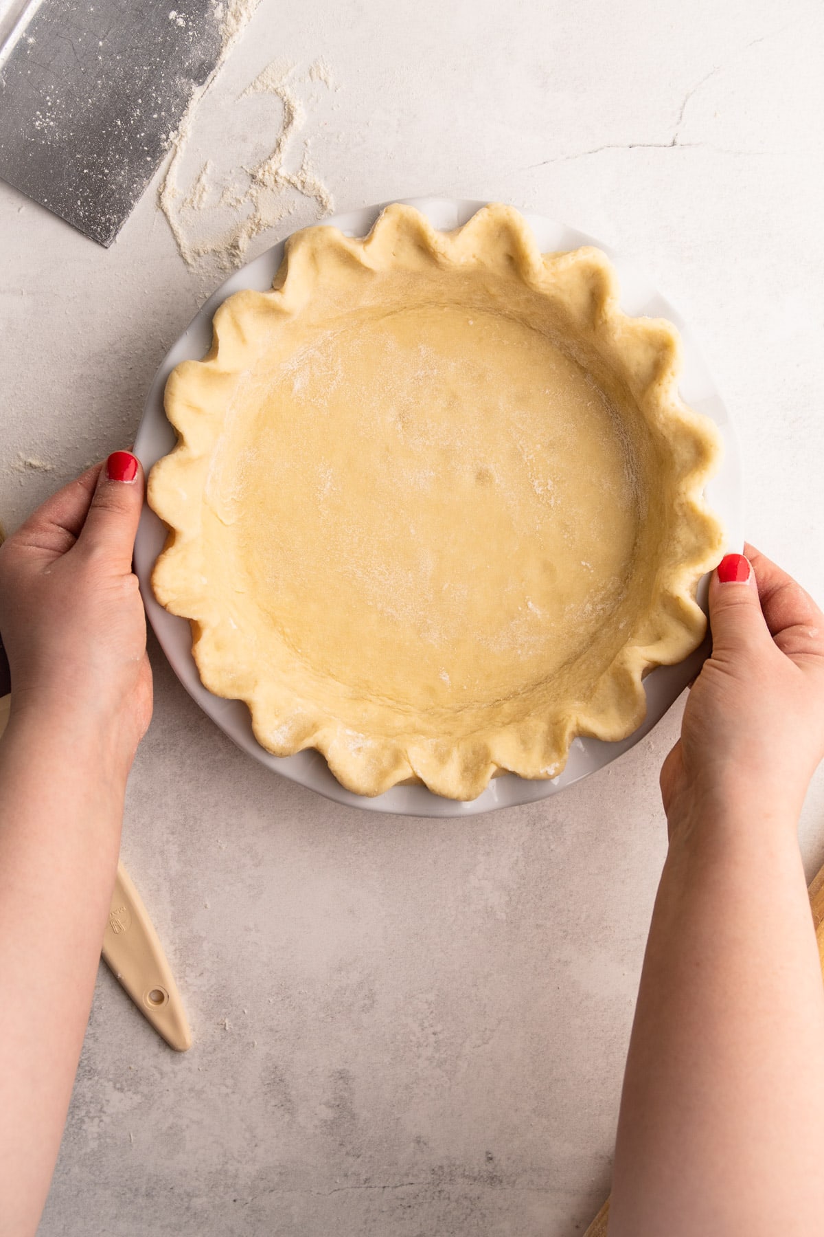 A perfect butter pie crust lining a pie dish.
