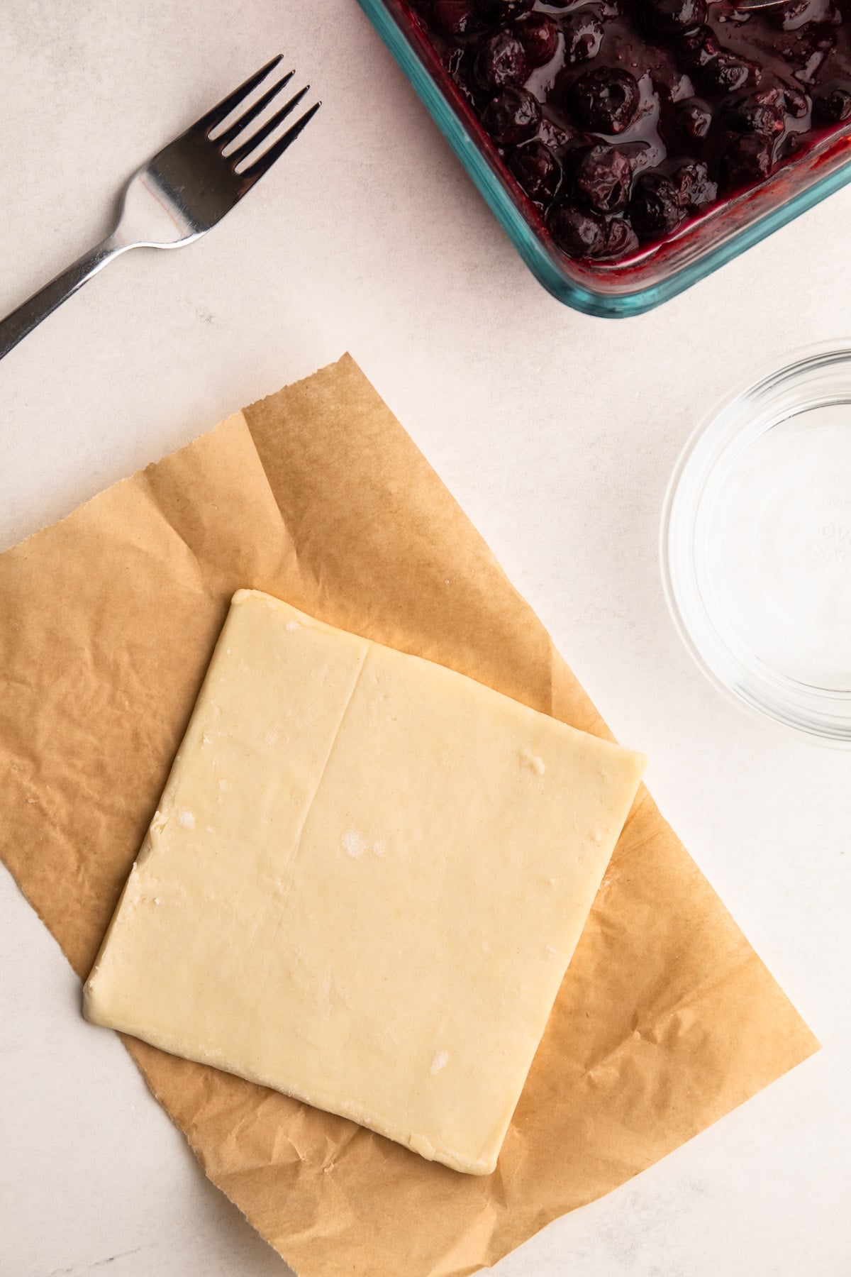 Filling blueberry turnovers.